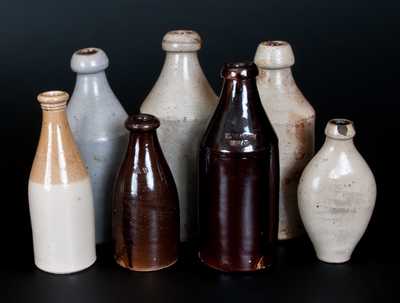Lot of Seven: Stoneware Bottles Including M. EATON / MEAD Marked Example