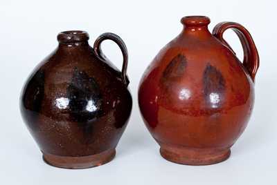 Lot of Two: Ovoid New England Redware Jugs with Manganese Sponging