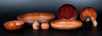 Lot of Nine: Redware Articles incl. Diminutive Jug, Slip-Decorated Plate, and Bank