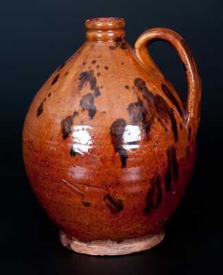 Two Pieces of American Redware, Jug and Plate, 19th century.