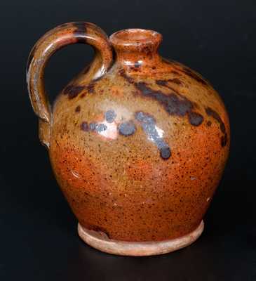 Diminutive Redware Jug with Manganese Splotches