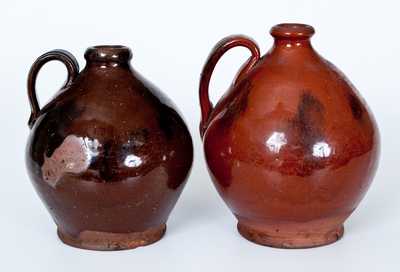 Lot of Two: Ovoid New England Redware Jugs with Manganese Sponging