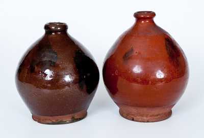 Lot of Two: Ovoid New England Redware Jugs with Manganese Sponging