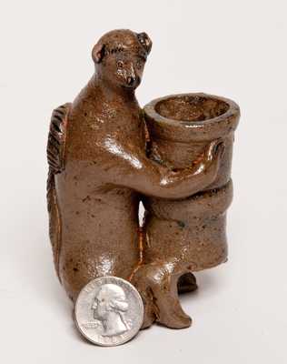 Stoneware Figure of a Monkey Holding a Flowerpot, probably Southern, possibly Decker (Tennessee)