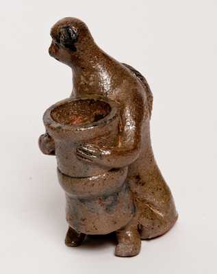 Stoneware Figure of a Monkey Holding a Flowerpot, probably Southern, possibly Decker (Tennessee)