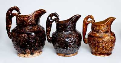 Lot of Three: Graduated Group of Bennington, VT Rockingham Ware Hunt Scene Pitchers