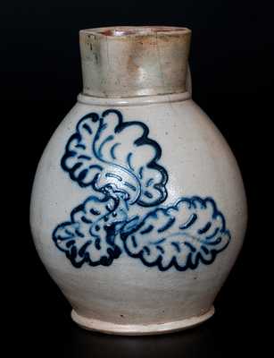 Unusual Northeastern U.S. Stoneware Pitcher with Finely Slip-Trailed Leaf Decoration