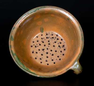 Rare Copper-Glazed Redware Colander, probably New England, first half 19th century