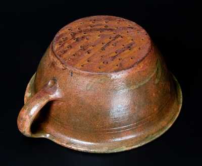 Rare Copper-Glazed Redware Colander, probably New England, first half 19th century