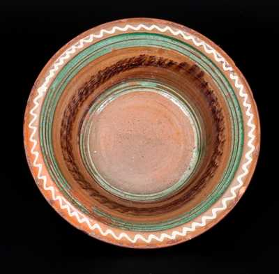 Fine Mid-Atlantic Redware Bowl with Three-Color Slip Interior