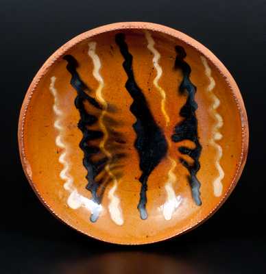 Redware Dish, probably Berks County, PA, with Alternating Lead and Manganese Slip Line Decoration