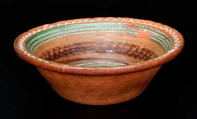 Fine Mid-Atlantic Redware Bowl with Three-Color Slip Interior