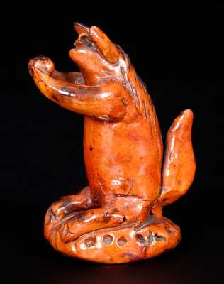 Unusual Redware Seated Squirrel Figure on Base, probably Pennsylvania, 19th century