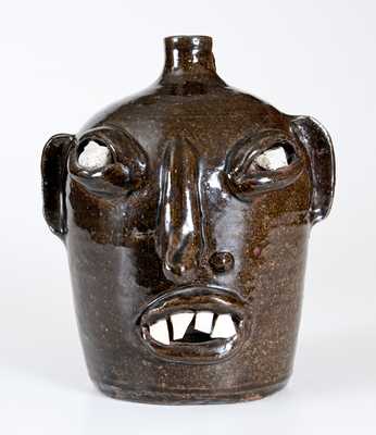 Stoneware Face Jug with Quartz Eyes and China Teeth, Southern US, 20th century