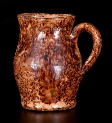 Very Fine JOHN BELL (Waynesboro, PA) Diminutive Redware Cream Pitcher w/ Sponged Manganese Decoration