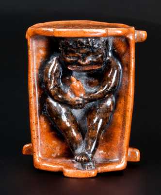 Extremely Rare Redware African-American Child in Cradle Bank