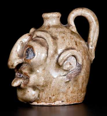 Outstanding Edgefield Stoneware Face Jug with Protruding Tongue, Edgefield, SC origin, circa 1860-80