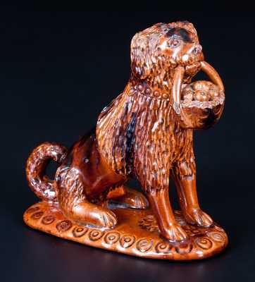 Glazed Pennsylvania Redware Figure of a Dog with Basket