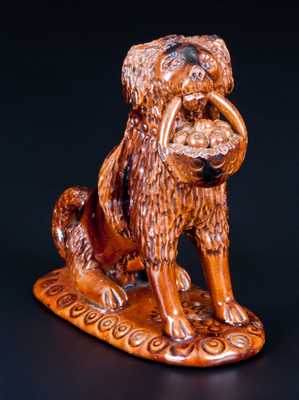 Glazed Pennsylvania Redware Figure of a Dog with Basket