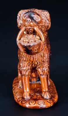 Glazed Pennsylvania Redware Figure of a Dog with Basket