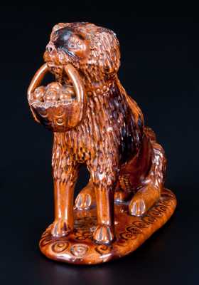 Glazed Pennsylvania Redware Figure of a Dog with Basket