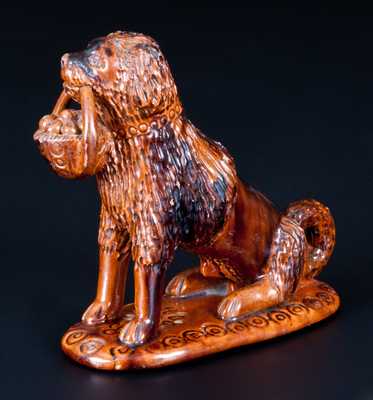 Glazed Pennsylvania Redware Figure of a Dog with Basket