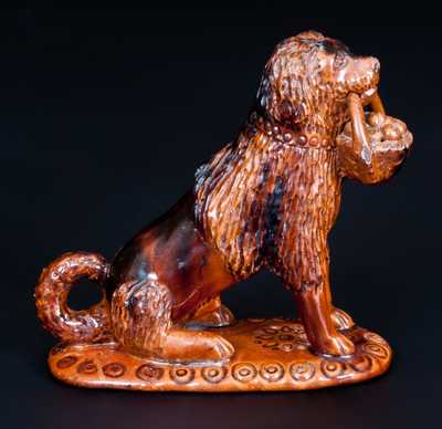Glazed Pennsylvania Redware Figure of a Dog with Basket