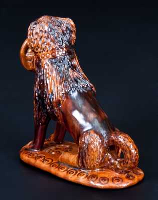 Glazed Pennsylvania Redware Figure of a Dog with Basket