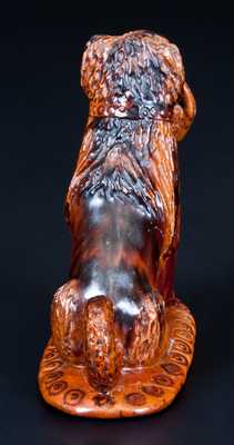 Glazed Pennsylvania Redware Figure of a Dog with Basket