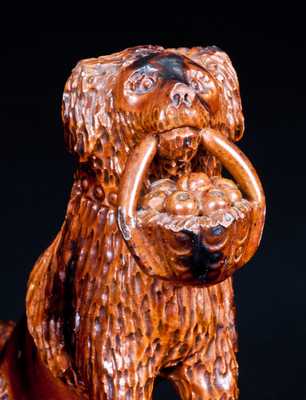 Glazed Pennsylvania Redware Figure of a Dog with Basket