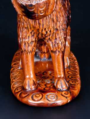 Glazed Pennsylvania Redware Figure of a Dog with Basket
