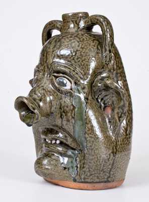 Unusual Alkaline-Glazed Stoneware Face Jug with Pig s Snout, Signed and Dated 
