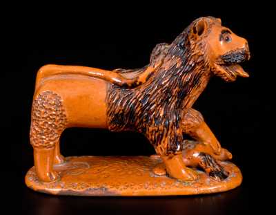 Exceedingly Rare Pennsylvania Redware Figure of a Lion Standing atop a Bird