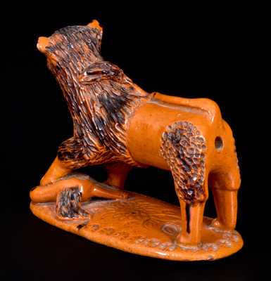 Exceedingly Rare Pennsylvania Redware Figure of a Lion Standing atop a Bird