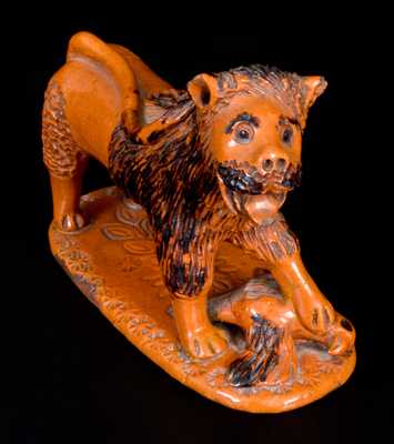 Exceedingly Rare Pennsylvania Redware Figure of a Lion Standing atop a Bird