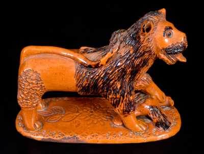 Exceedingly Rare Pennsylvania Redware Figure of a Lion Standing atop a Bird