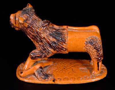 Exceedingly Rare Pennsylvania Redware Figure of a Lion Standing atop a Bird