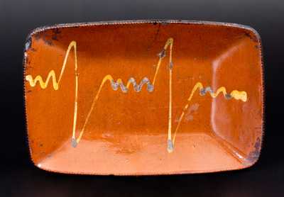 Redware Loaf Dish with Unusual Yellow Slip Decoration, probably Long Island or CT