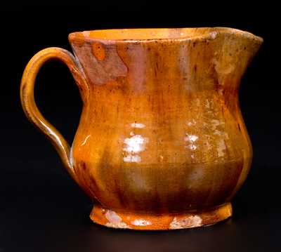 Bulbous Redware Cream Pitcher with Vibrant Lead Glaze