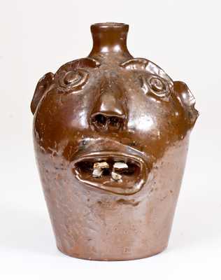 Stoneware Face Jug, Stamped 