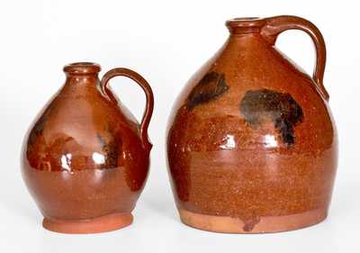 Lot of Two: Ovoid Redware Jugs with Manganese Decoration