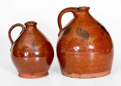 Lot of Two: Ovoid Redware Jugs with Manganese Decoration