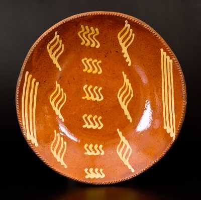 Outstanding Slip-Decorated Philadelphia Redware Charger, early to mid 19th century