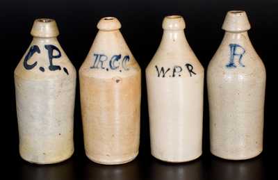 Lot of Four: Stoneware Bottles with Slip-Trailed Cobalt Letter Inscriptions