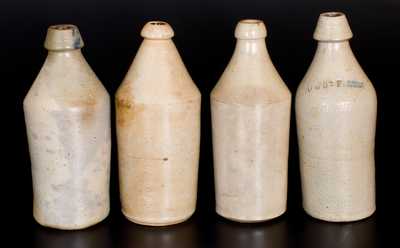 Lot of Four: Stoneware Bottles with Slip-Trailed Cobalt Letter Inscriptions