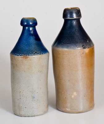 Lot of Two: Stoneware Bottles with Cobalt-Dipped Tops and Impressed Advertising