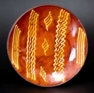 Exceptional Large-Sized Philadelphia Redware Charger w/ Slip Decoration, early 19th century