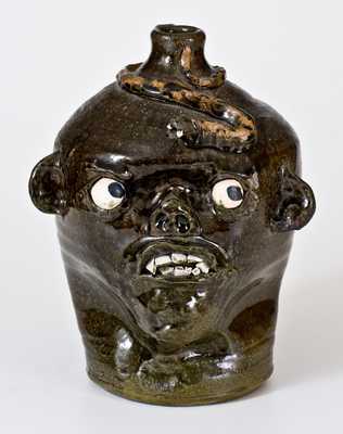 Chester Hewell, Gillsville, GA, Stoneware Face Jug w/ Applied Snake