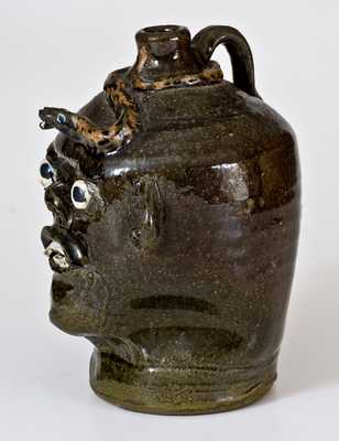 Chester Hewell, Gillsville, GA, Stoneware Face Jug w/ Applied Snake