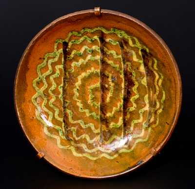 Pennsylvania Redware Plate with Elaborate Three-Color Slip Swirl Decoration